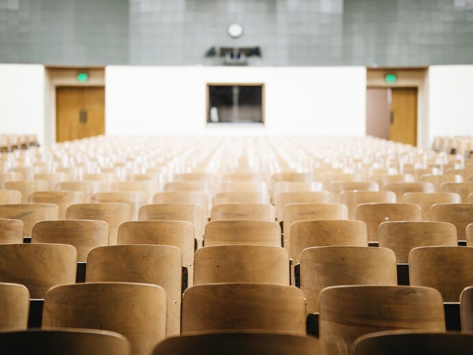 photo of a lecture theatre with rows of chairs