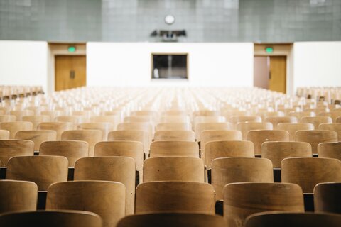 photo of a lecture theatre with rows of chairs